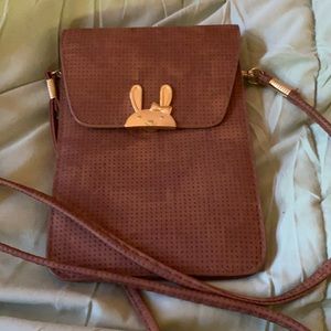 crossbody front snap bunny detail long strap